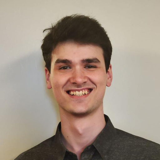 A headshot of Max Kenny.